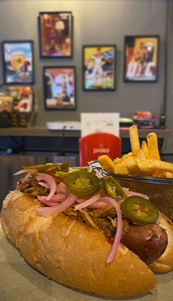 Close-up of a juicy hotdog at Upperdeck Bangkok